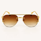Vista frontal do Mionelle Halo Brown, com estrutura dourada e lentes marrons em degradê
