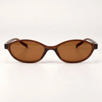 Vista frontal do Mionelle Narrow Vibe Rich Brown, com armação marrom âmbar translúcida e lentes marrons