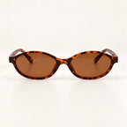 Vista frontal do Mionelle Narrow Vibe Vintage Tartaruga, com armação âmbar e preto e lentes marrons