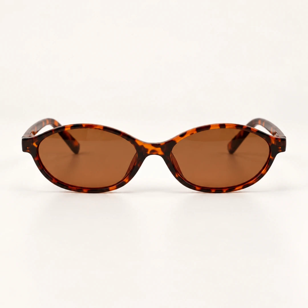 Vista frontal do Mionelle Narrow Vibe Vintage Tartaruga, com armação âmbar e preto e lentes marrons