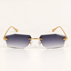 Vista frontal do Mionelle Aura Shadow, com estrutura dourada e lentes cinza em degradê