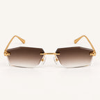 Vista frontal do Mionelle Aura Vintage Brown, com estrutura dourada e lentes marrons em degradê