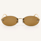 Vista frontal do Mionelle Luna Brown Vintage, com estrutura dourada e lentes marrons em tom âmbar