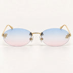 Vista frontal do Mionelle Luna Sky Blue, com estrutura dourada e lentes em degradê azul e rosa